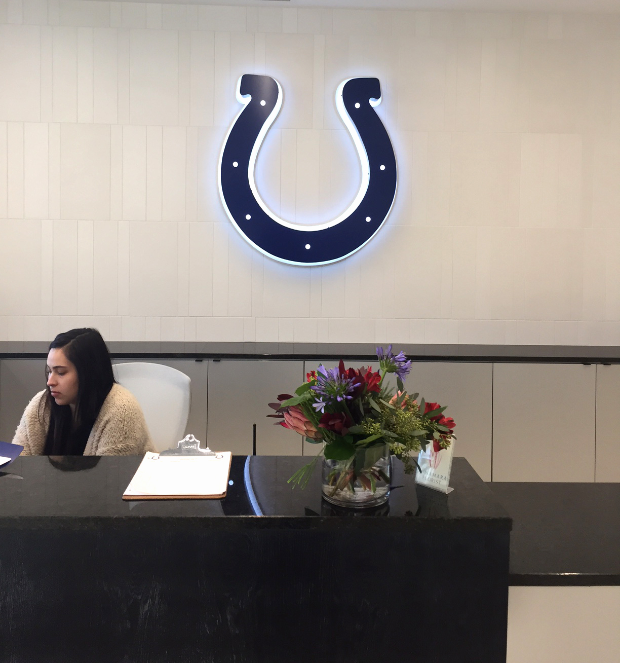 Huston brings illuminated Colts horseshoe logo to life in new Colts complex lobby.